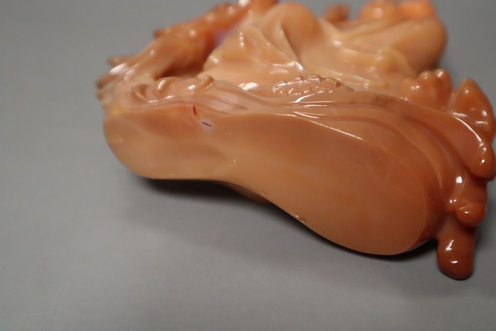 A Chinese chalcedony carving of Guanyin and a dragon, 13.5cm high